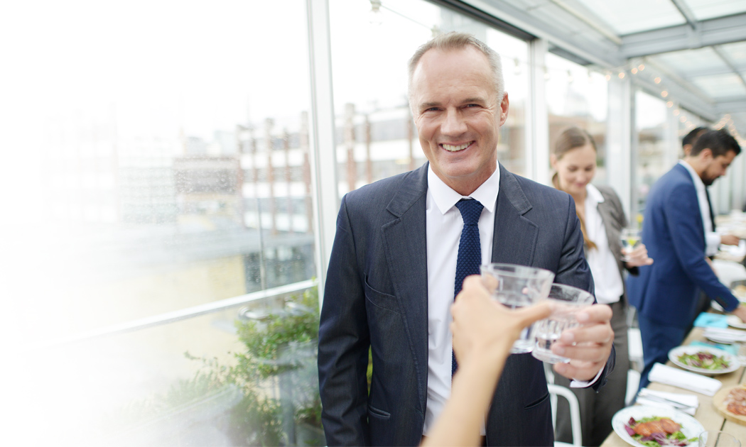 two people toasting glasses