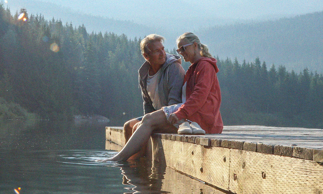 Couple sitting on dock 