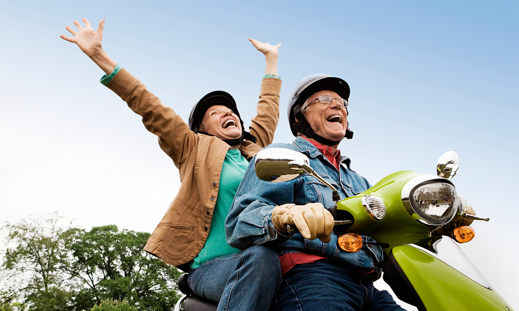 older couple on a moped