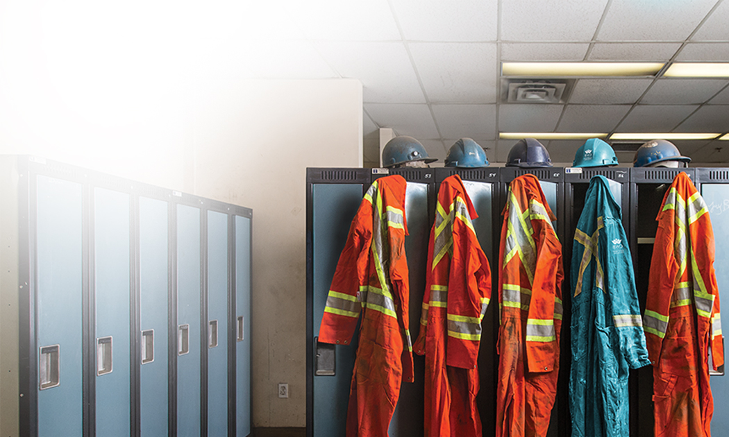 Teal Coveralls amongst orange ones
